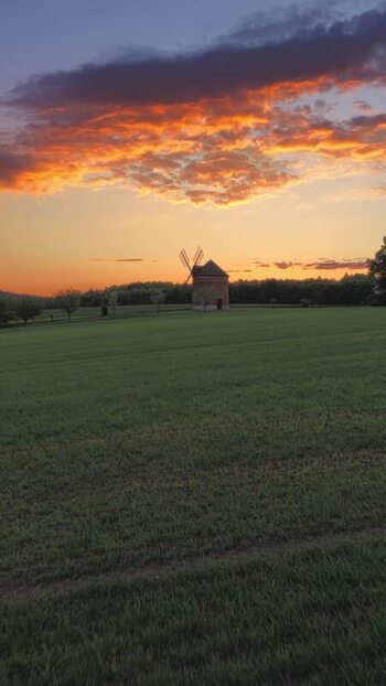 Aerial view of a historic windmill at sunset in Czechia. Aerial view of a historic windmill at sunset in Czechia.