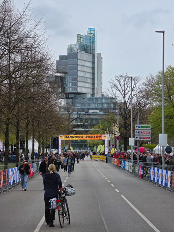 Hanover Germany 12 April 2026 View of the NordLB building in the background with runners and spectators gathering on the street for the Hannover Marathon event.