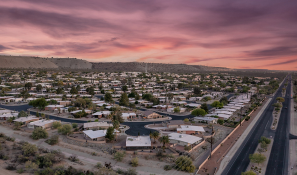 Aerial view of a residential neighborhood with desert landscape sunset sky houses and roads in Green Valley Arizona United States. Aerial view of a residential neighborhood with desert landscape sunset sky houses and roads in Green Valley Arizona United States.