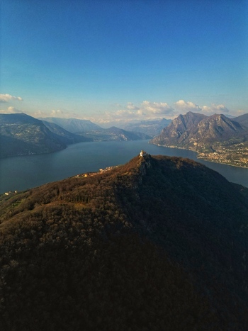 Aerial view of the Sanctuary of Madonna della Ceriola on the summit of the mountain on Lake Iseo Monte Isola Lombardy Italy. Aerial view of the Sanctuary of Madonna della Ceriola on the summit of the mountain on Lake Iseo Monte Isola Lombardy Italy.