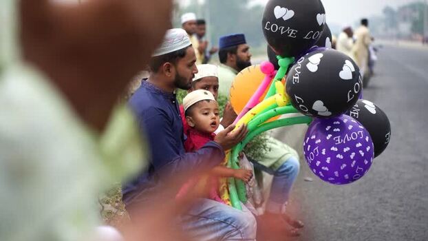 View of a man and child with colorful balloons Bangladesh. View of a man and child with colorful balloons Bangladesh.