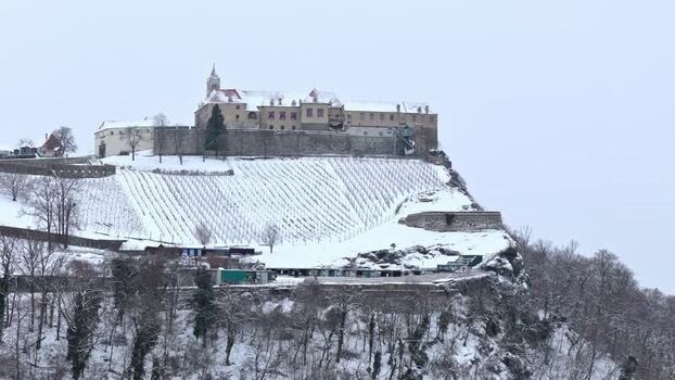 Aerial view of Riegersburg Castle on a snowy hill Austria.