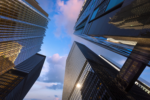 View of modern skyscrapers and glass office buildings reflecting the sunset sky in the financial district of Toronto Ontario Canada. View of modern skyscrapers and glass office buildings reflecting the sunset sky in the financial district of Toronto Ontario Canada.