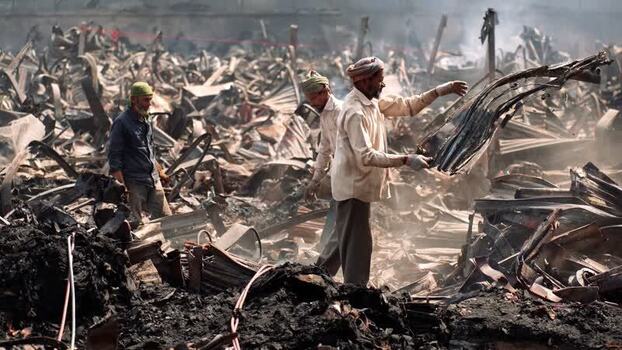 View of men working amidst debris in Dhaka Bangladesh. View of men working amidst debris in Dhaka Bangladesh.