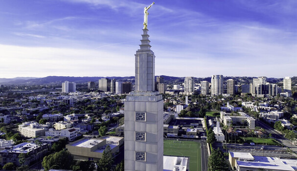 Aerial view of the Los Angeles California Temple with its iconic gold statue atop the white stone tower surrounded by the urban landscape of Los Angeles CA United States. Aerial view of the Los Angeles California Temple with its iconic gold statue atop the white stone tower surrounded by the urban landscape of Los Angeles CA United States.