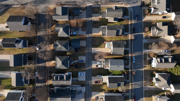 Aerial view of a suburban residential neighborhood with houses driveways and streets in Lynchburg Virginia United States.