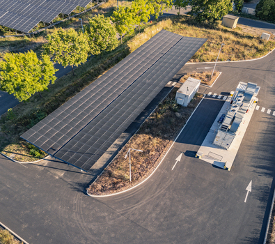 Aerial view of a battery energy storage system integrated with a solar photovoltaic carport supporting renewable energy in Le Pouzin Auvergne Rhone Alpes France. Aerial view of a battery energy storage system integrated with a solar photovoltaic carport supporting renewable energy in Le Pouzin Auvergne Rhone Alpes France.