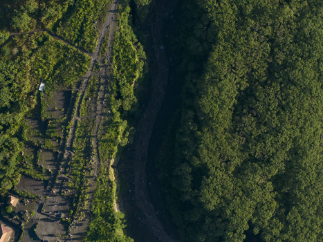 Aerial view of Bunker Kaliadem Merapi area featuring a deep volcanic ravine and dense tropical forest in Kecamatan Pakem Daerah Istimewa Yogya Indonesia. Aerial view of Bunker Kaliadem Merapi area featuring a deep volcanic ravine and dense tropical forest in Kecamatan Pakem Daerah Istimewa Yogya Indonesia.