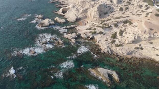 Aerial view of rocky coastline with turquoise sea Cyprus.