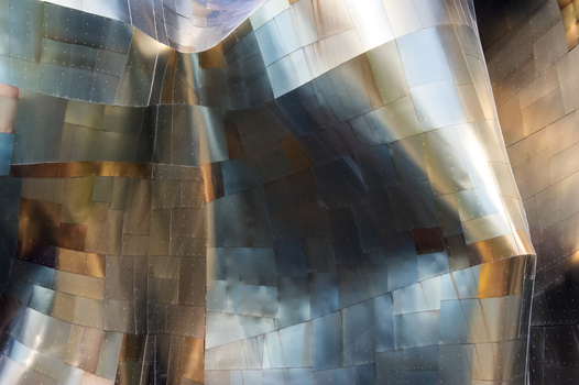 View of the metallic curved and riveted exterior panels of the Museum of Pop Culture in Seattle Washington United States.