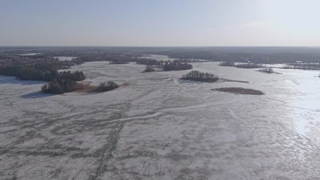Aerial view of islands in frozen lake Galve Lithuania.