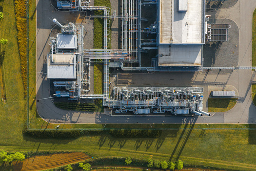 Aerial view of the UGS Damborice facility with complex piping systems and industrial structures surrounded by green fields in Damborice South Moravian Region Czechia. Aerial view of the UGS Damborice facility with complex piping systems and industrial structures surrounded by green fields in Damborice South Moravian Region Czechia.