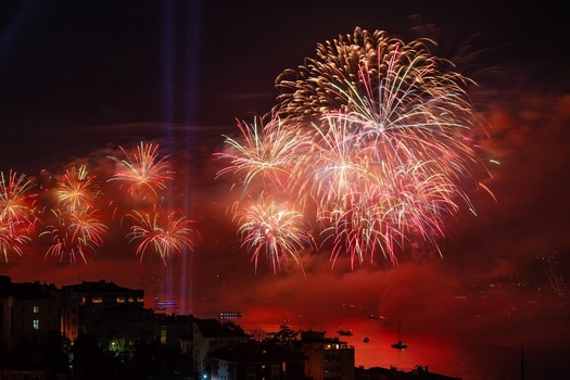 View of fireworks on Bosphorus illuminating the night sky over the city skyline and water in Istanbul Turkey. View of fireworks on Bosphorus illuminating the night sky over the city skyline and water in Istanbul Turkey.