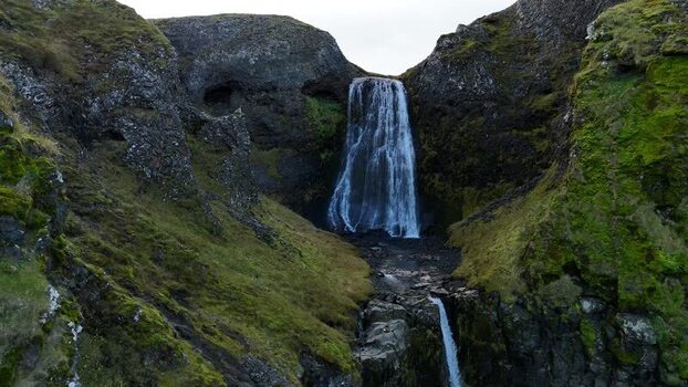Aerial view of Bugsfoss waterfall in the mountains of Iceland.
