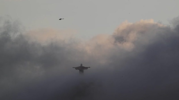 View of Christ the Redeemer statue through clouds Brazil.
