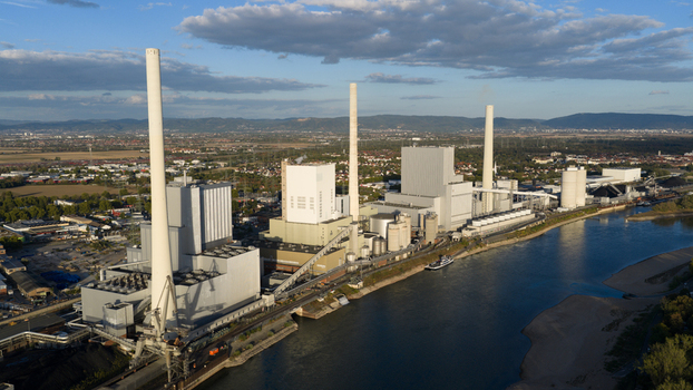 Aerial view of the Grosskraftwerk Mannheim power plant with its tall chimneys and industrial facilities situated along the Rhine river in Mannheim Baden Wurttemberg Germany.