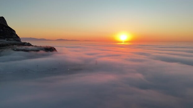 Aerial view of Europa Point at sunset over clouds Gibraltar.