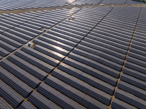 Aerial view of a large solar farm with rows of photovoltaic panels reflecting sunlight in the industrial landscape of Lovech Lovech Bulgaria. Aerial view of a large solar farm with rows of photovoltaic panels reflecting sunlight in the industrial landscape of Lovech Lovech Bulgaria.