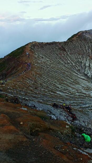 View of Ijen Crater with sulfuric smoke Indonesia.