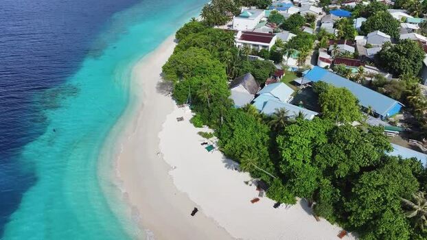 Aerial view of the white sand beach and village of Maalhos Maldives. Aerial view of the white sand beach and village of Maalhos Maldives.