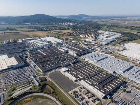 Aerial view of Volkswagen plant near Devinska Nova Ves with vast industrial halls parking lots filled with cars and green hills in Bratislava Bratislavsky kraj Slovakia. Aerial view of Volkswagen plant near Devinska Nova Ves with vast industrial halls parking lots filled with cars and green hills in Bratislava Bratislavsky kraj Slovakia.
