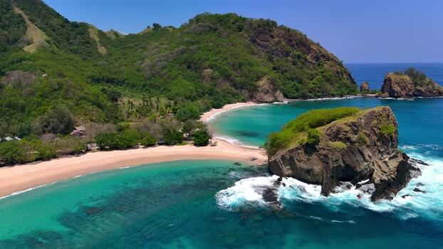 Aerial view of Koka Beach with turquoise water and lush hills Indonesia. Aerial view of Koka Beach with turquoise water and lush hills Indonesia.