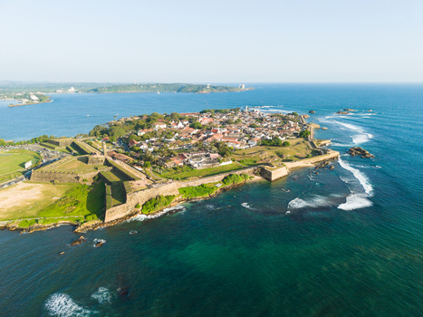Aerial view of Galle Fort with its historic stone walls and red roofed buildings surrounded by the turquoise Indian Ocean Galle Southern Province Sri Lanka.