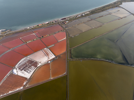 Aerial view of the salt pans in Pomorie showing the contrast between the pink and green water basins along the Black Sea coast in Pomorie Burgas Bulgaria. Aerial view of the salt pans in Pomorie showing the contrast between the pink and green water basins along the Black Sea coast in Pomorie Burgas Bulgaria.