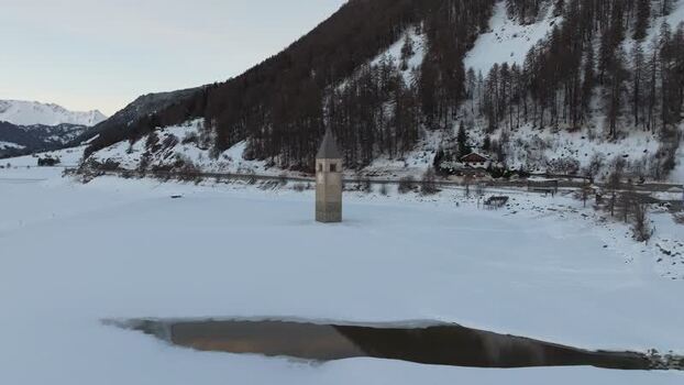 Aerial view of the sunken bell tower in Graun im Vinschgau Italy. Aerial view of the sunken bell tower in Graun im Vinschgau Italy.