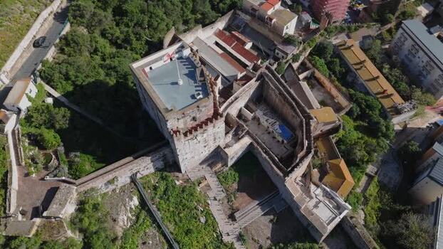 Aerial view of the historic Moorish Castle in Gibraltar. Aerial view of the historic Moorish Castle in Gibraltar.