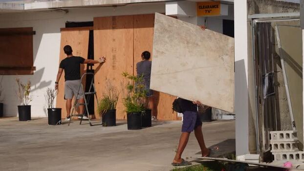 View of residents boarding up windows in San Jose Northern Mariana Islands. View of residents boarding up windows in San Jose Northern Mariana Islands.