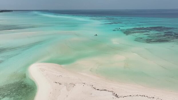 Aerial view of sandbars and turquoise waters in Fulhadhoo Maldives.