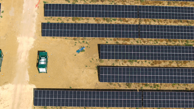 Aerial view of the Eaton Socon Substation solar farm and battery energy storage systems with rows of photovoltaic panels arranged on the ground in St. Neots England United Kingdom. Aerial view of the Eaton Socon Substation solar farm and battery energy storage systems with rows of photovoltaic panels arranged on the ground in St. Neots England United Kingdom.