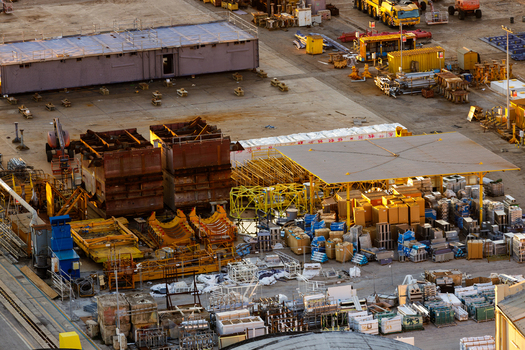 Aerial view of Ancona Port showing industrial storage yard with shipping containers construction materials and heavy equipment in Ancona Marche Italy. Aerial view of Ancona Port showing industrial storage yard with shipping containers construction materials and heavy equipment in Ancona Marche Italy.