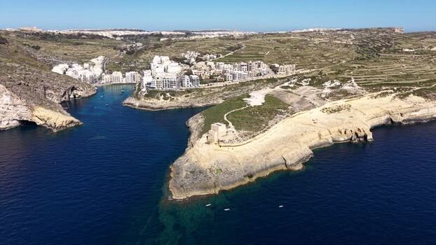 Aerial view of Xlendi Tower and the bay in Munxar Malta. Aerial view of Xlendi Tower and the bay in Munxar Malta.