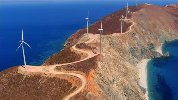 Aerial view of wind turbines on a ridge in Greece. Aerial view of wind turbines on a ridge in Greece.