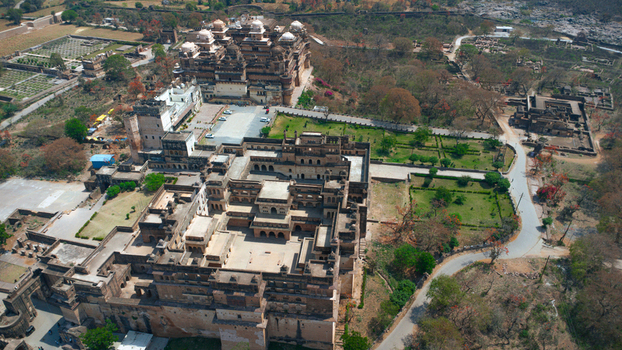 Orchha India 08 May 2026 Aerial view of the historic Orchha Fort complex featuring the Raja Mahal and Jahangir Mahal with their intricate stone architecture and courtyards. Orchha India 08 May 2026 Aerial view of the historic Orchha Fort complex featuring the Raja Mahal and Jahangir Mahal with their intricate stone architecture and courtyards.