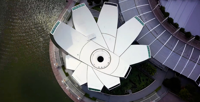 Aerial view of the ArtScience Museum with its iconic lotus inspired white roof structure situated by the waterfront in Singapore Singapore. Aerial view of the ArtScience Museum with its iconic lotus inspired white roof structure situated by the waterfront in Singapore Singapore.