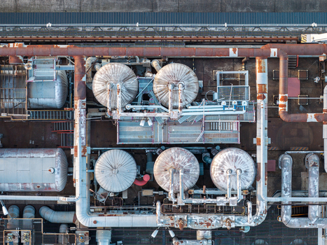 Aerial view of industrial storage tanks complex piping systems and metallic structures at Heizkraftwerk Klingenberg Berlin Berlin Germany. Aerial view of industrial storage tanks complex piping systems and metallic structures at Heizkraftwerk Klingenberg Berlin Berlin Germany.