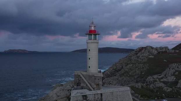 Aerial view of Faro de Punta Nariga lighthouse Spain.