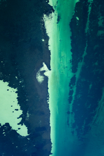 Aerial view of turquoise ocean patterns and deep blue water along the coastline of the Shire of Shark Bay Western Australia Australia. Aerial view of turquoise ocean patterns and deep blue water along the coastline of the Shire of Shark Bay Western Australia Australia.