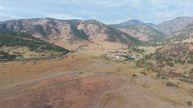 Aerial view of rolling hills and highway in Golden United States.
