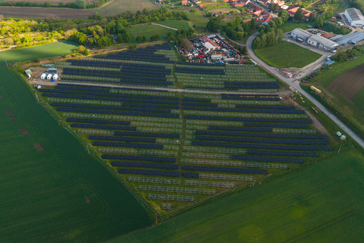 Aerial view of FVE Bohumilice solar power plant with rows of photovoltaic panels surrounded by lush green fields and rural landscape Klobouky u Brna Jihomoravsky kraj Czechia. Aerial view of FVE Bohumilice solar power plant with rows of photovoltaic panels surrounded by lush green fields and rural landscape Klobouky u Brna Jihomoravsky kraj Czechia.