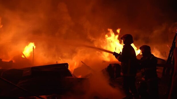 View of firefighters battling a massive blaze Bangladesh. View of firefighters battling a massive blaze Bangladesh.