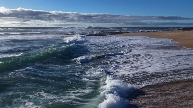 Aerial view of beach and ocean waves Portugal.