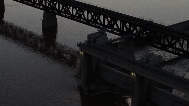 Aerial view of a steel bridge and dam at dusk United States.