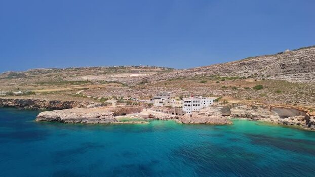 Aerial view of Ghar Lapsi Malta with cliffs and turquoise coastal bays Aerial view of Ghar Lapsi Malta with cliffs and turquoise coastal bays