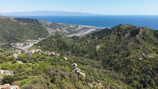 Aerial view of the historic village of Savoca on a green hill Italy. Aerial view of the historic village of Savoca on a green hill Italy.
