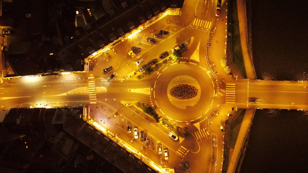 Aerial view of a roundabout illuminated by streetlights at night in Pontoise Ile de France France. Aerial view of a roundabout illuminated by streetlights at night in Pontoise Ile de France France.