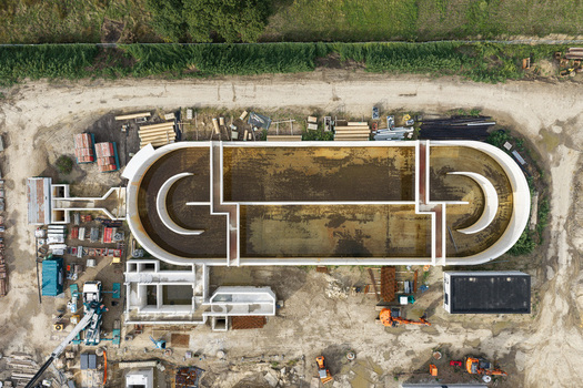 Diepenbeek Belgium 30 August 2026 Aerial view of the wastewater treatment plant in Diepenbeek showing the large oval aeration tank construction machinery and surrounding earthworks. Diepenbeek Belgium 30 August 2026 Aerial view of the wastewater treatment plant in Diepenbeek showing the large oval aeration tank construction machinery and surrounding earthworks.